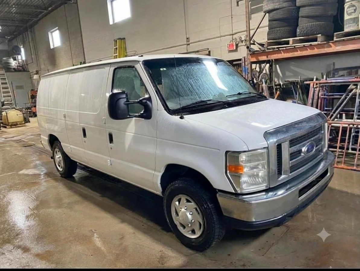 Ford E-150 full-size cargo van in the VG Well-Being Transport fleet